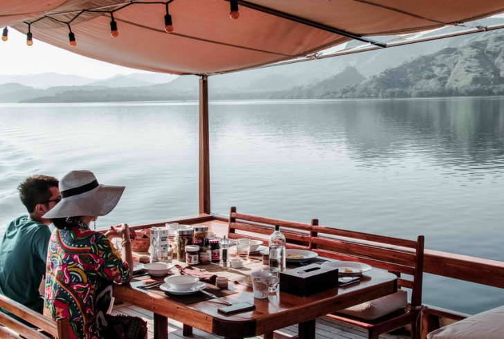 Couple enjoying breakfast with ocean view