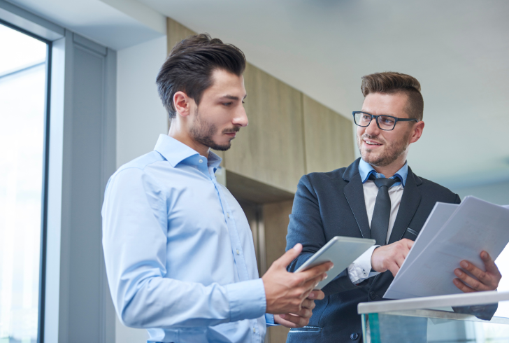 Leader reviewing finances with advisor